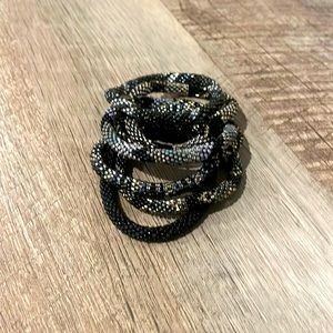 Assortment of beaded bracelets stack